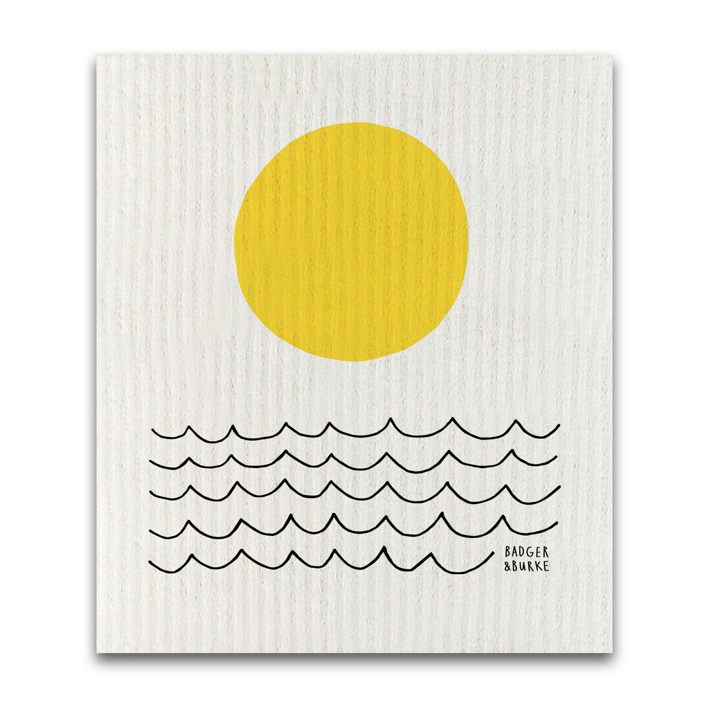 a swedish sponge cloth featuring a minimalist illustration of a yellow sun and black wavy lines representing the sea