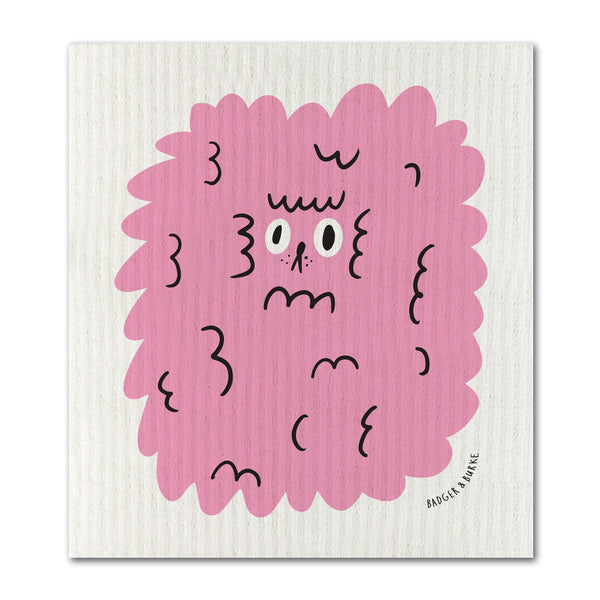 a swedish sponge cloth featuring an illustration of a ridiculous fluffy face of a pink dog 