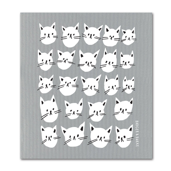 a grey swedish sponge cloth featuring an illustration of numerous white cat faces in rows and colums