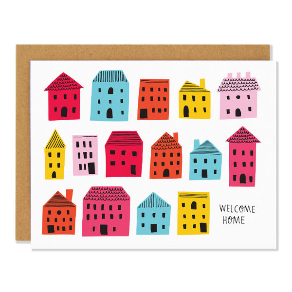 a housewarming greeting card featuring a mid century inspired illustration of simple colourful houses with text reading "welcome home"
