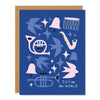 christmas or holiday greeting card in blue and pinks featuring cut out mid century inspired illustrations of doves, trumpets, stars, bells, and drums. Text reads: "Joy to the World"