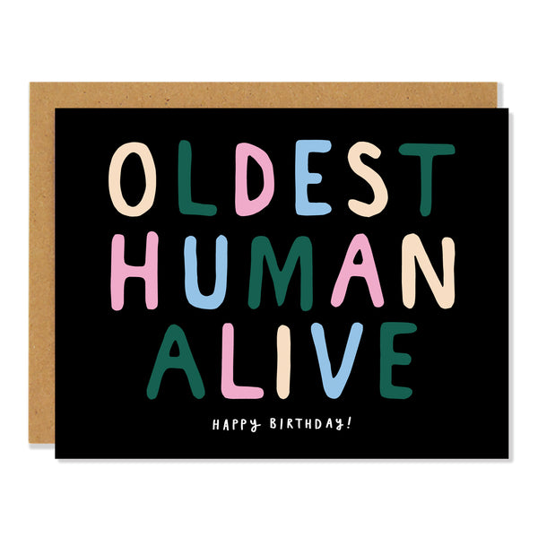 a birthday greeting card with multi coloured bubble text that reads: "OLDEST HUMAN ALIVE" and underneath in small white writing "Happy Birthday!"