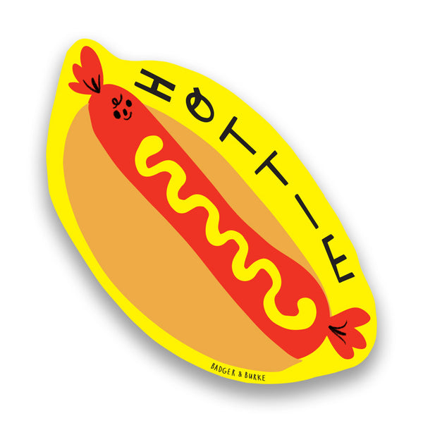 a sticker featuring an illustration of a red hot dog with yellow mustard with text reading "HOTTIE" on a yellow background