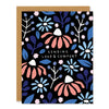 a sympathy greeting card featuring a floral illustration in blue and coral tones with handwritten text that reads: "sending love & comfort"