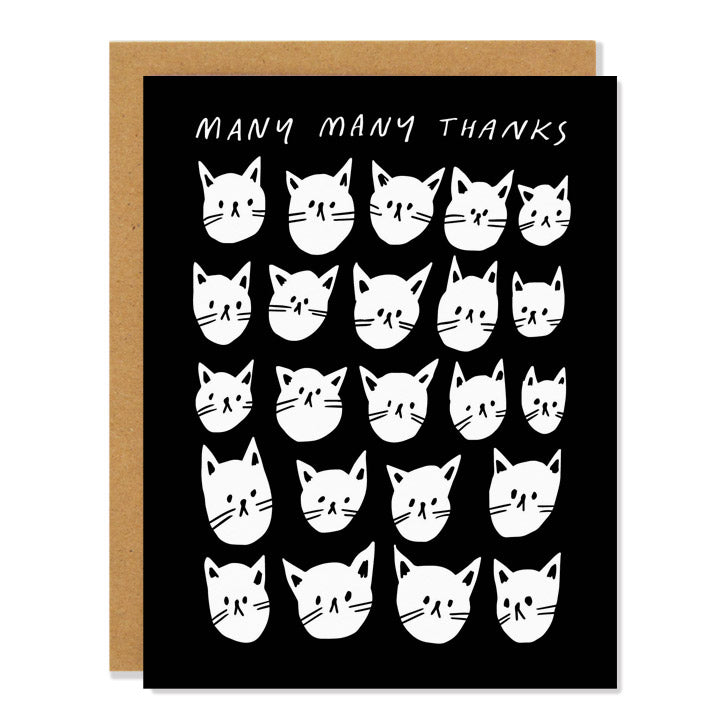 a thank you greeting card featuring an illustration of a multitude of white cat faces against a black background. Text reads: "many many thanks"