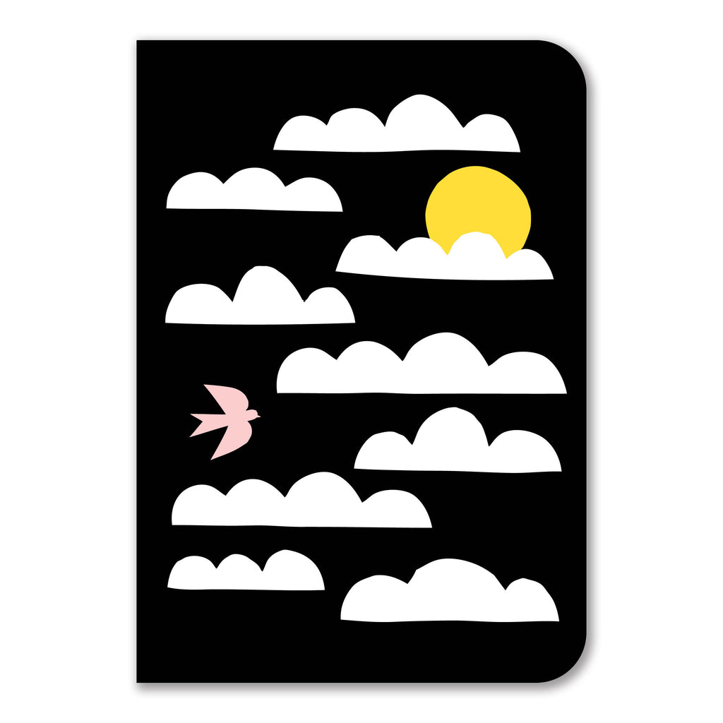 a notebook featuring an illustration of a yellow sun peeking out from behind white clouds against a black background, with a pink bird flying in the sky.
