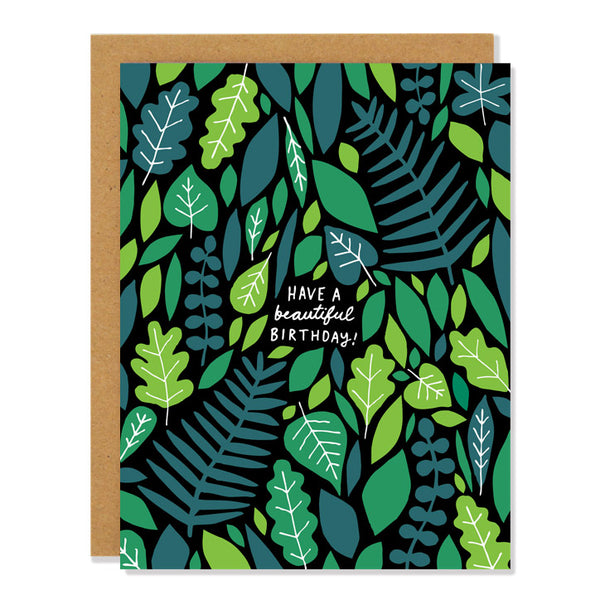 leafy green cut out design in different shades of green, text reads "have a beautiful birthday"