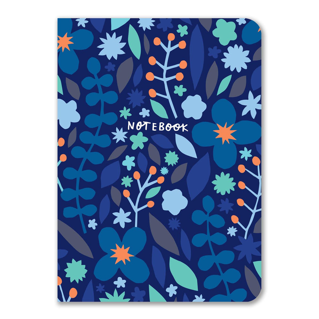 A notebook with a dark blue floral design featuring different shades of blue, green, and orange flowers and leaves on the cover.