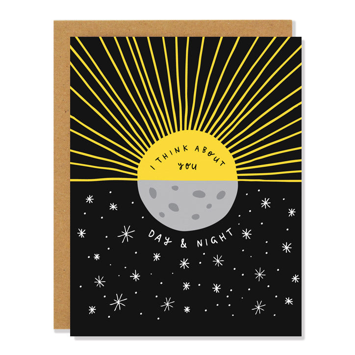 A greeting card with a yellow sun and a gray moon on a black background with white stars, with the text "I THINK ABOUT YOU DAY & NIGHT" in the center.