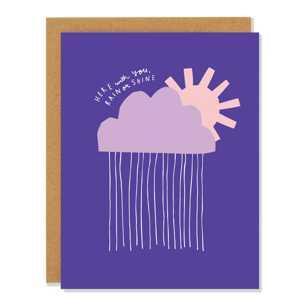 a sympathy greeting card featuring a cut out illustration of a raincloud and sunshine in shades of purple and pink. The text above the cloud reads "here with you, rain or shine"