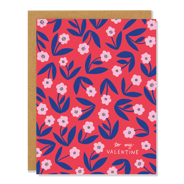 a valentine's day greeting card featuring an all over floral pattern in blue and pink on a red background with the text "to my Valentine" on the bottom corner.