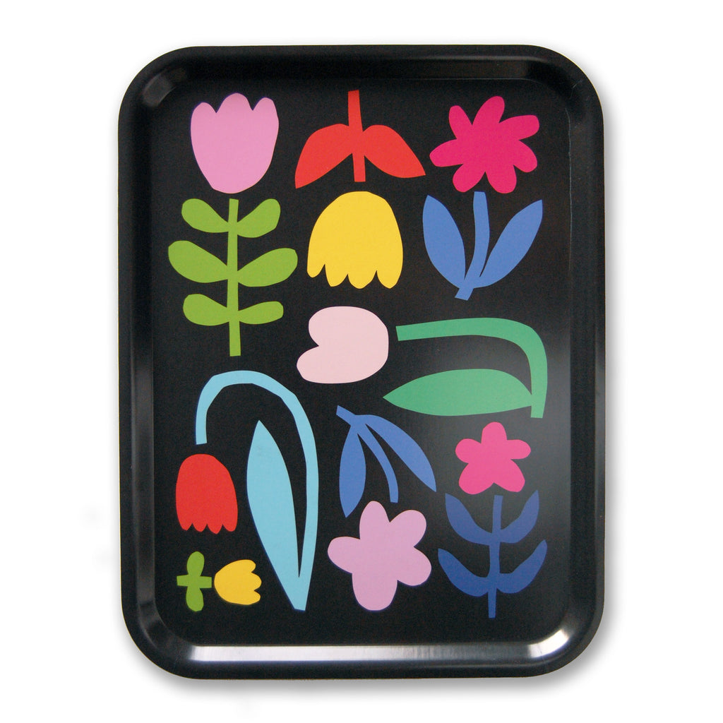 a black birch tray featuring a colourful pattern of abstract flower cut outs evoking scandinavian and mid century design