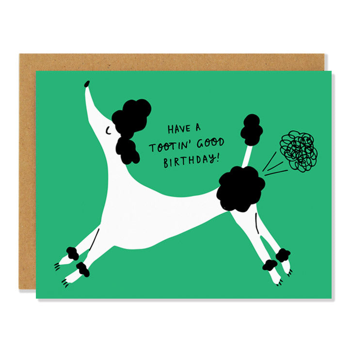 A birthday greeting card featuring an illustration of a poodle on a green background releasing a scribbly fart cloud. The text above the poodle reads: "Have a tootin' good birthday!"